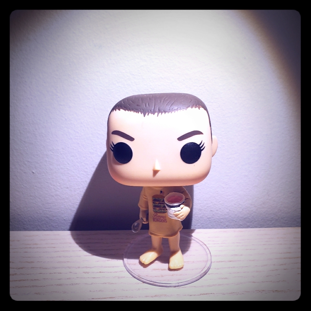 A funko pop doll of eleven